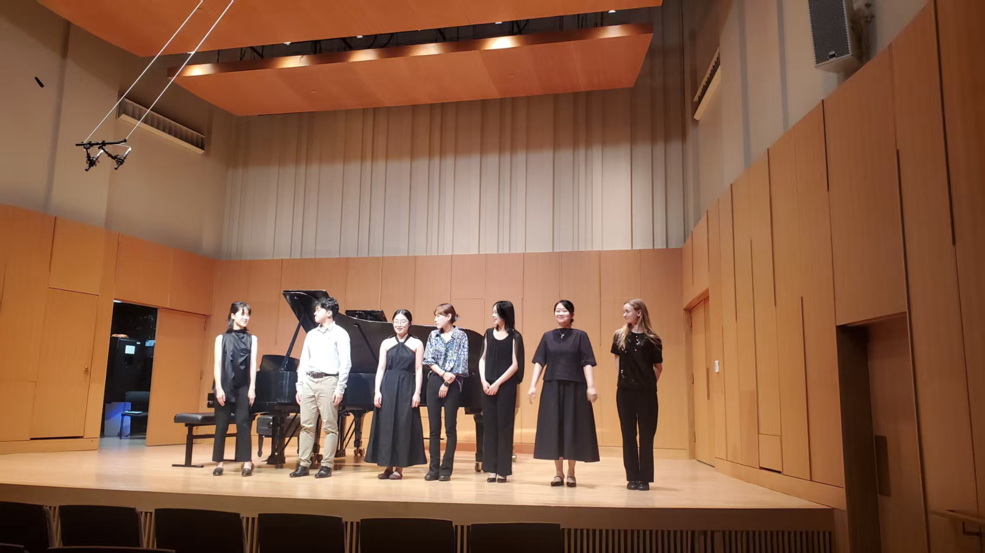 Yi-Hui Chen lined up with fellow performers on the Cook Recital Hall stage after a concert