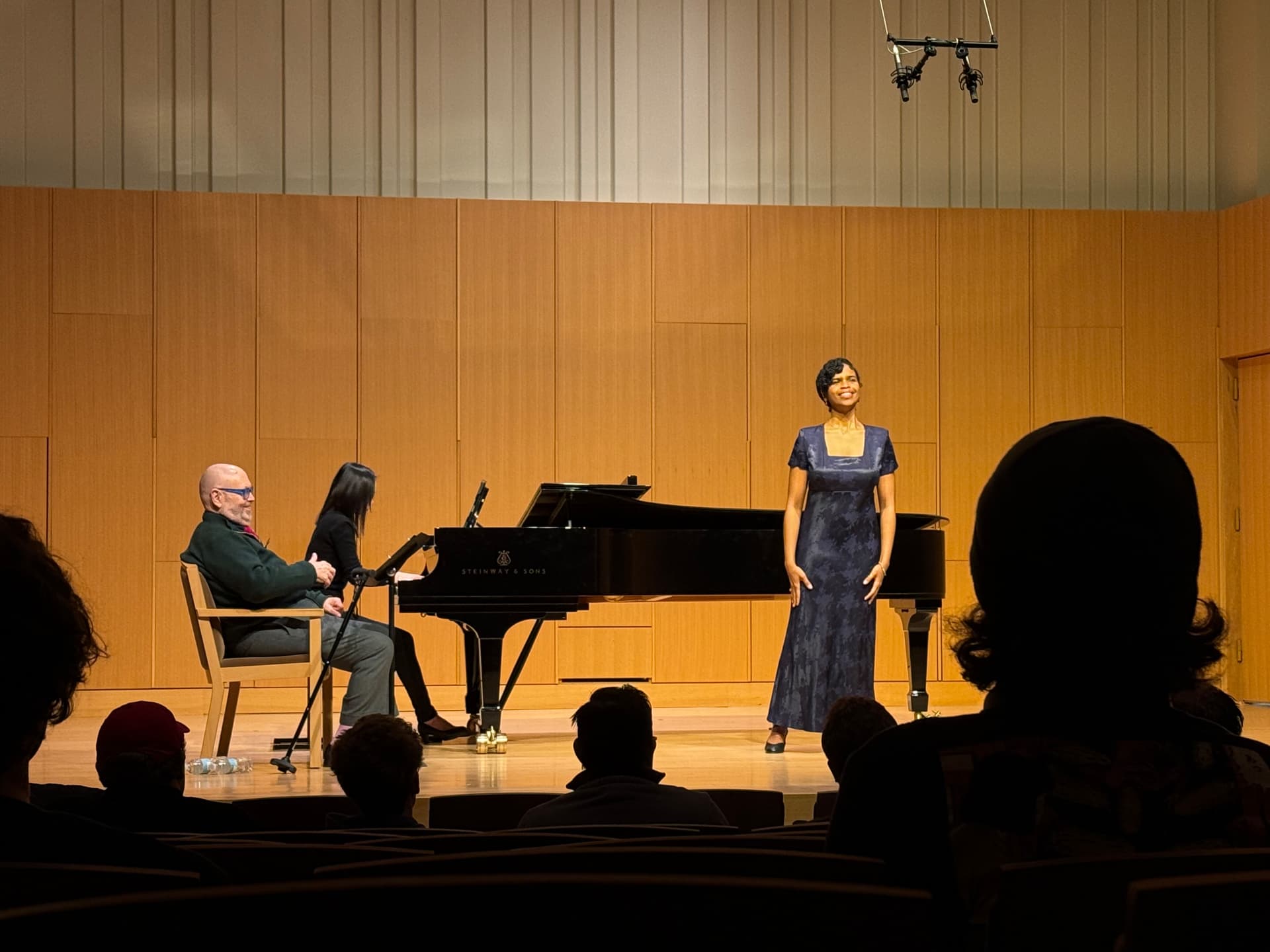 Yi-Hui Chen at the piano accompanying a vocalist in a concert hall