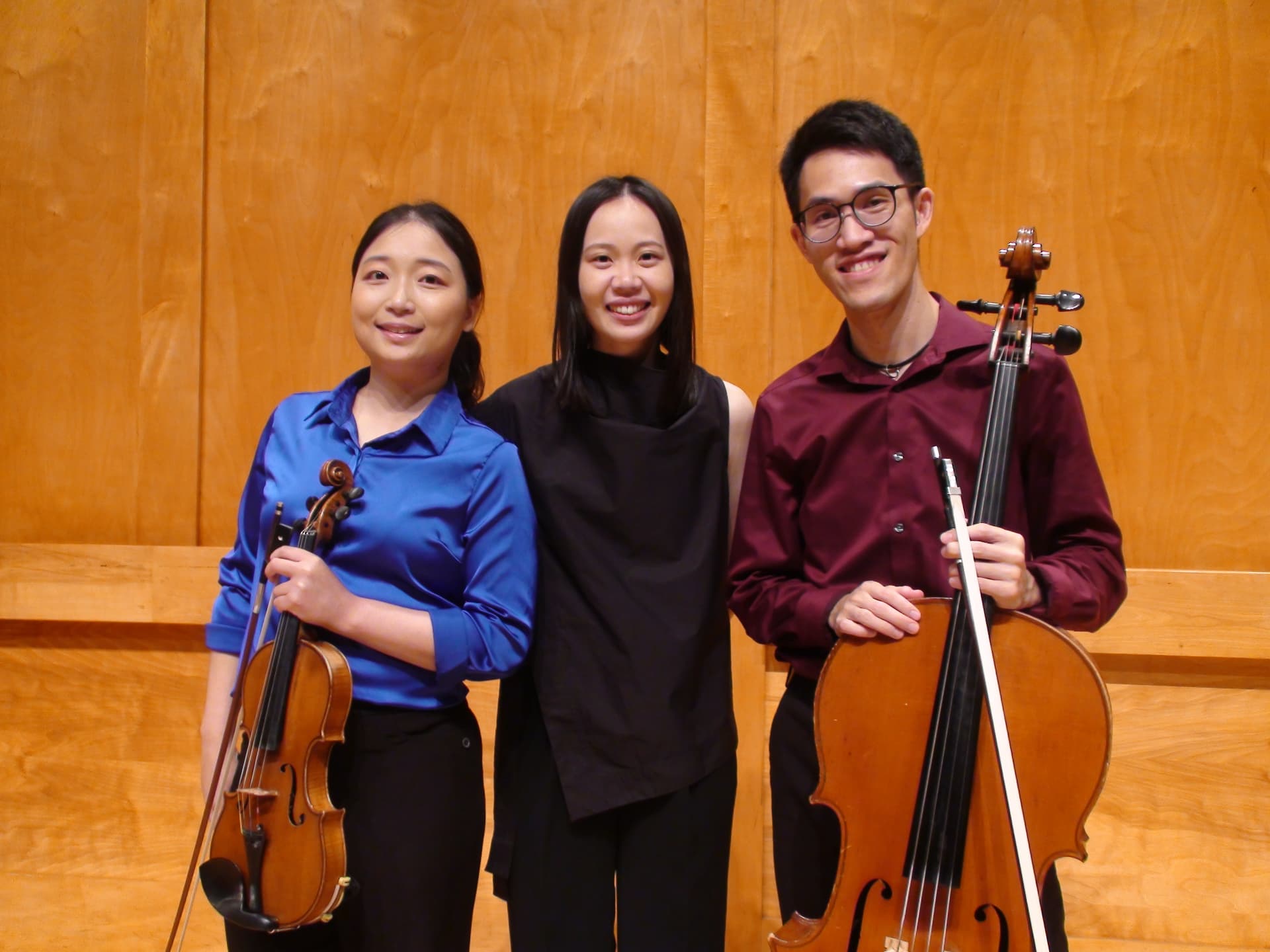 Yi-Hui Chen backstage with a violinist and a cellist after a trio performance